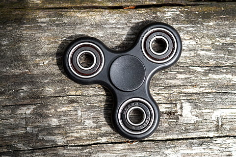 3-blade fidget spinner on gray wooden surface, Toys, Trend HD wallpaper