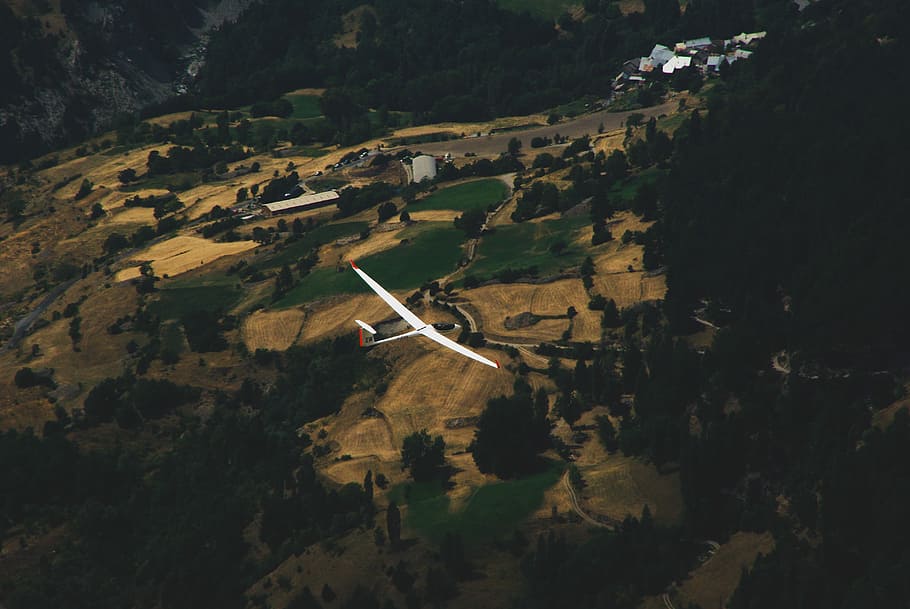 White glider, Embrun, France, aerial photography of white airplane flying with mountain and trees view during daytime HD wallpaper