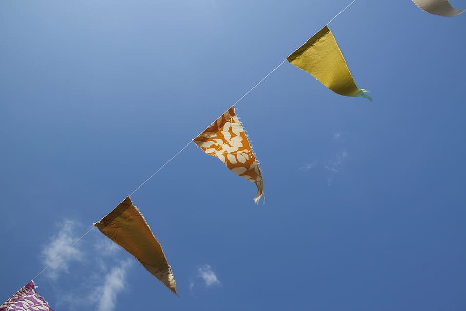 assorted-color bunting under clear blue sky during daytime HD wallpaper