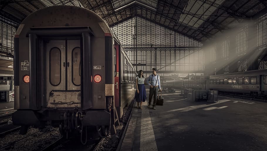 woman and man beside train photo, transportation system, railway