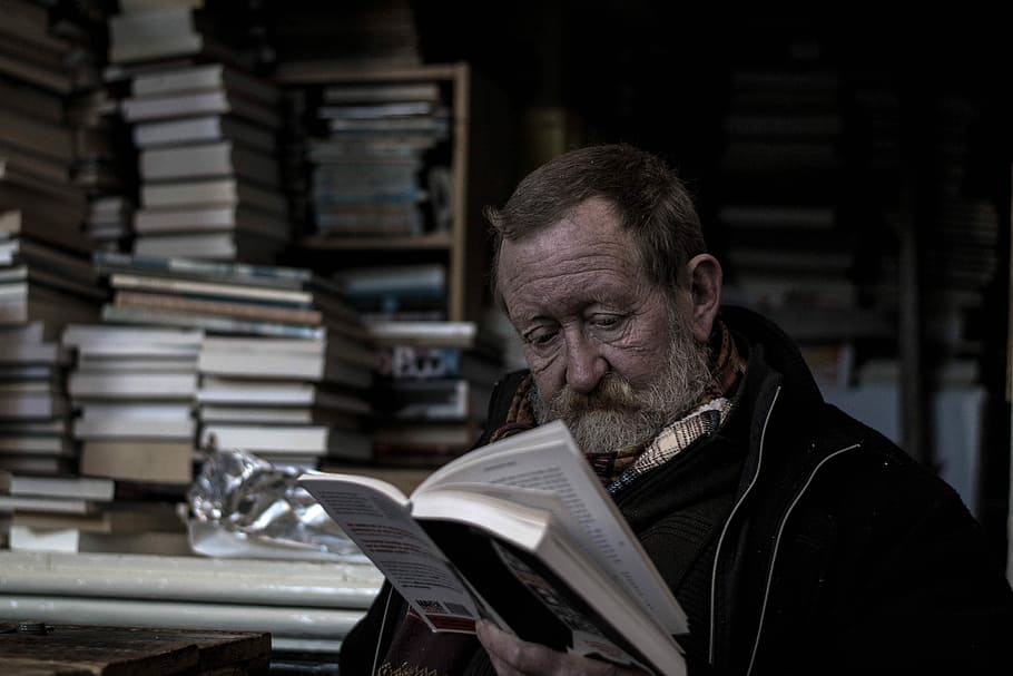 man reading a books, man reading book, bookstore, person, sitting HD wallpaper