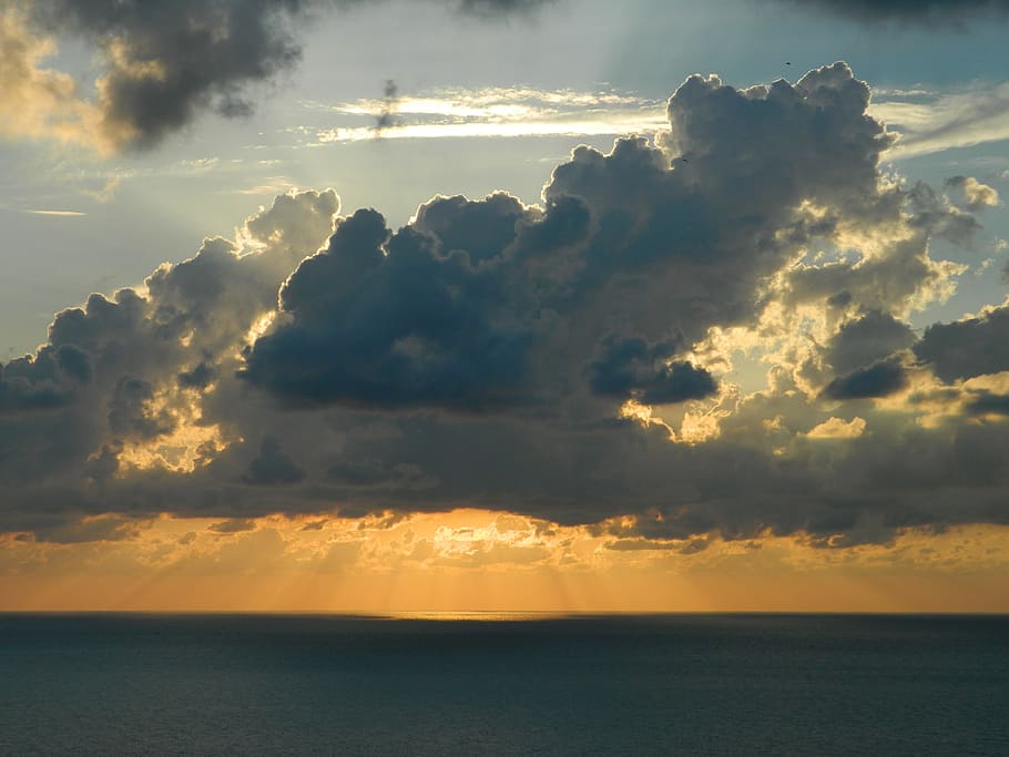Sun Behind the White Clouds Above Body of Water during Daytime HD wallpaper