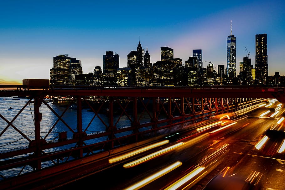 A long-exposure shot of light trails on the freeway with the New York city skyline at the back, landscape photography of New York City HD wallpaper