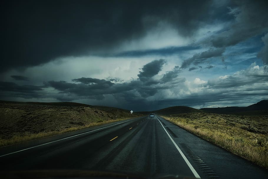 asphalt road near field under white clouds, gray asphalt road under gray cloudy sky HD wallpaper