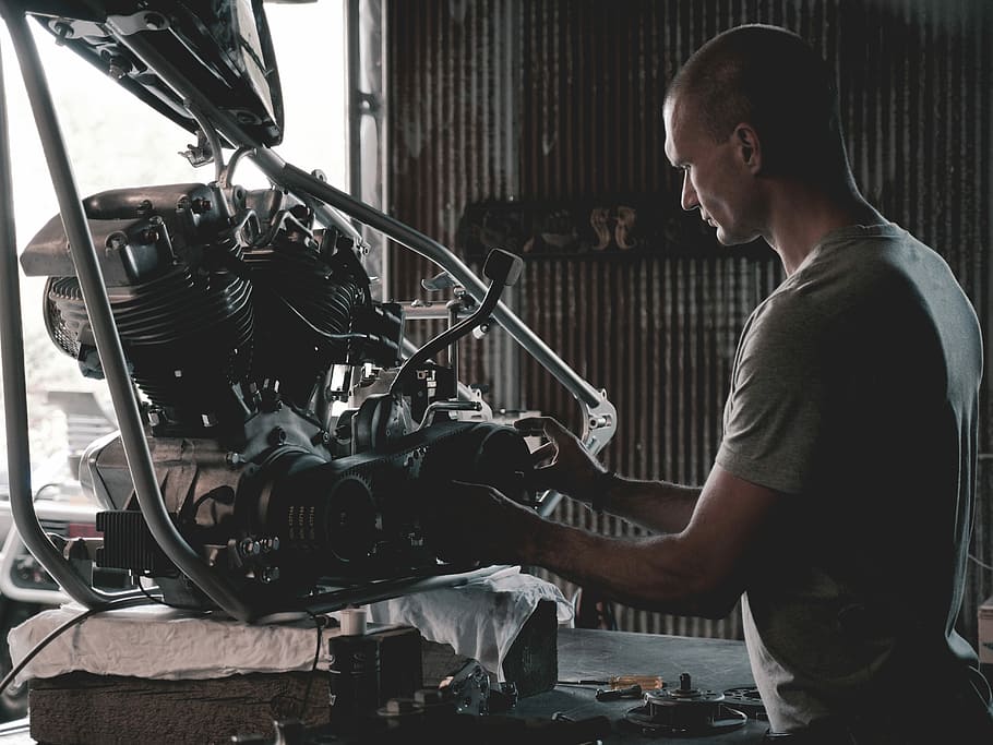 man holding engines, person holding motorcycle engine, real people HD wallpaper