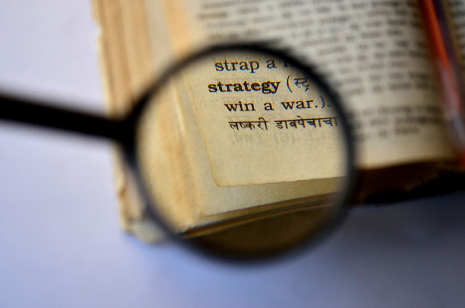 magnifying glass showing book page, strategy, dictionary, magnifier