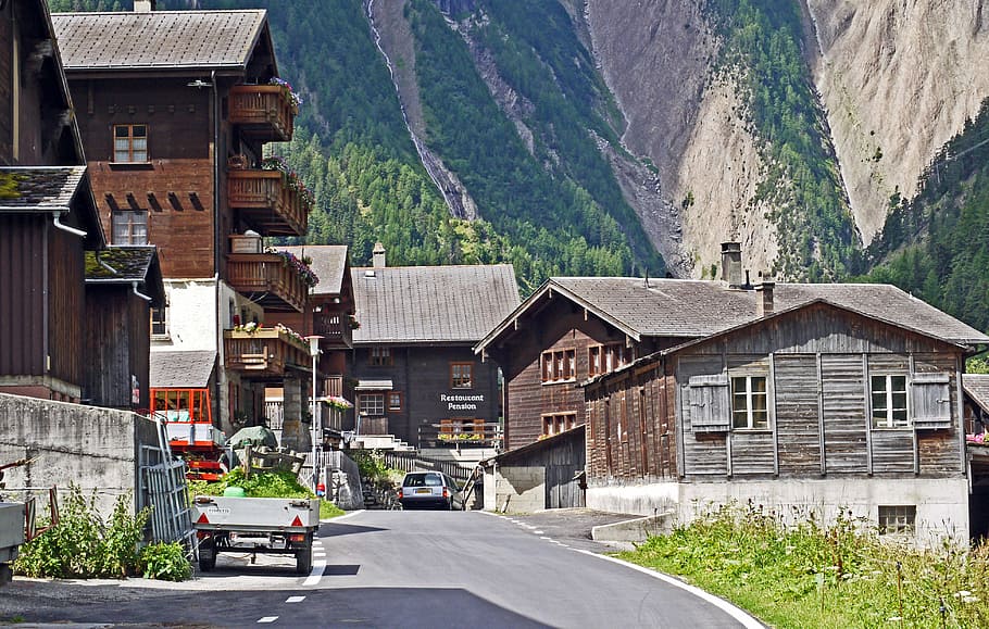 Switzerland, Valais, Bergdorf, wooden houses, mountains, slope