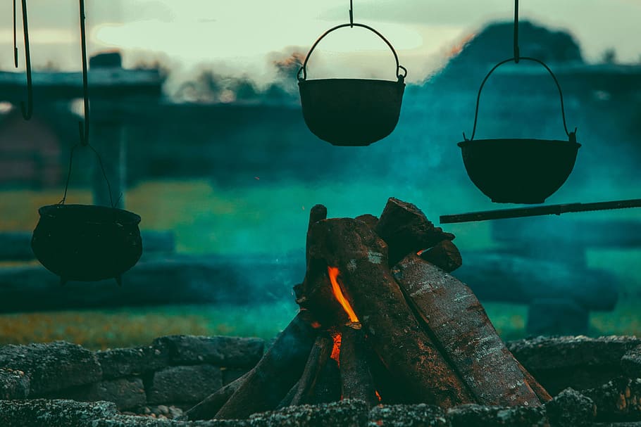 three pots hanged near campfire during dawn, bricks, burning HD wallpaper