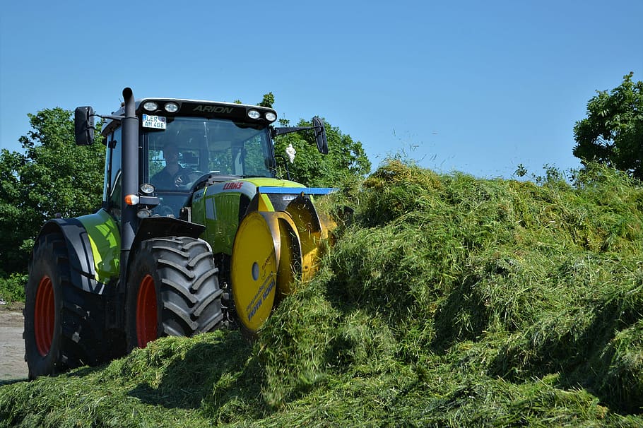 black, yellow, and blue tractor, claas, silo, harvest workers HD wallpaper
