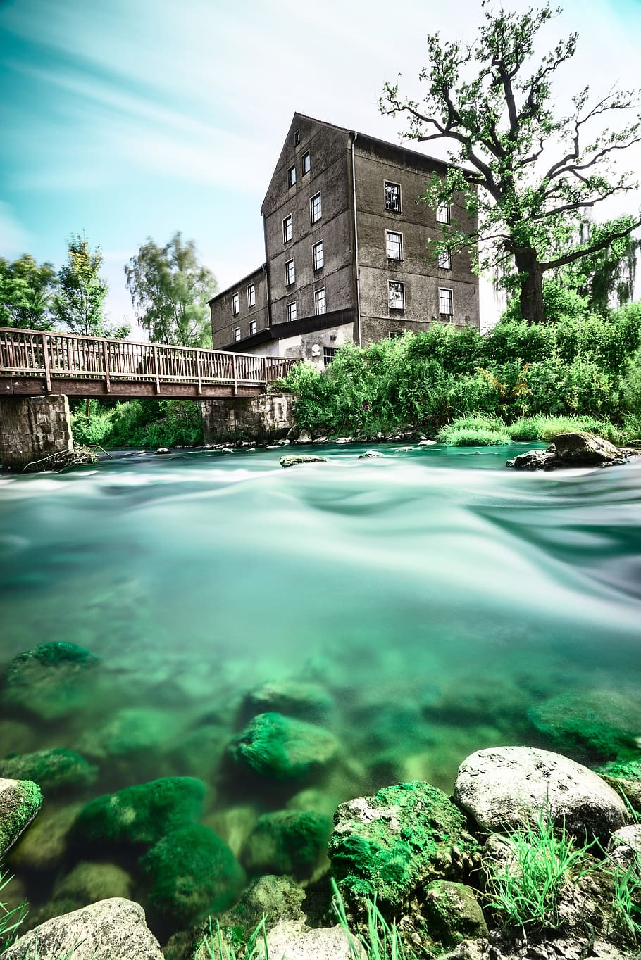 black 4-story house near concrete bridge and river, building HD wallpaper