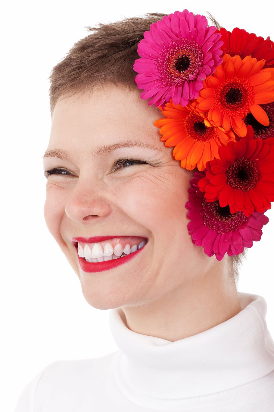 smiling woman with pink and red flowers on her ear, adult, beautiful