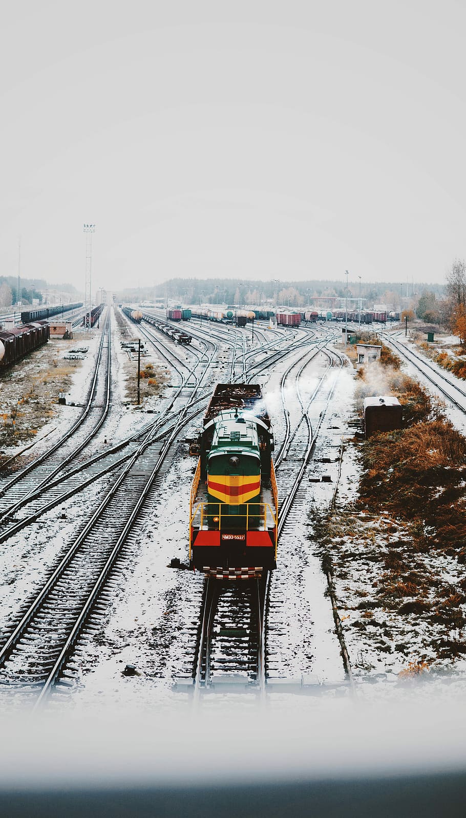 moving yellow and green locomotive train on train railways, closeup photo of train on railway HD wallpaper