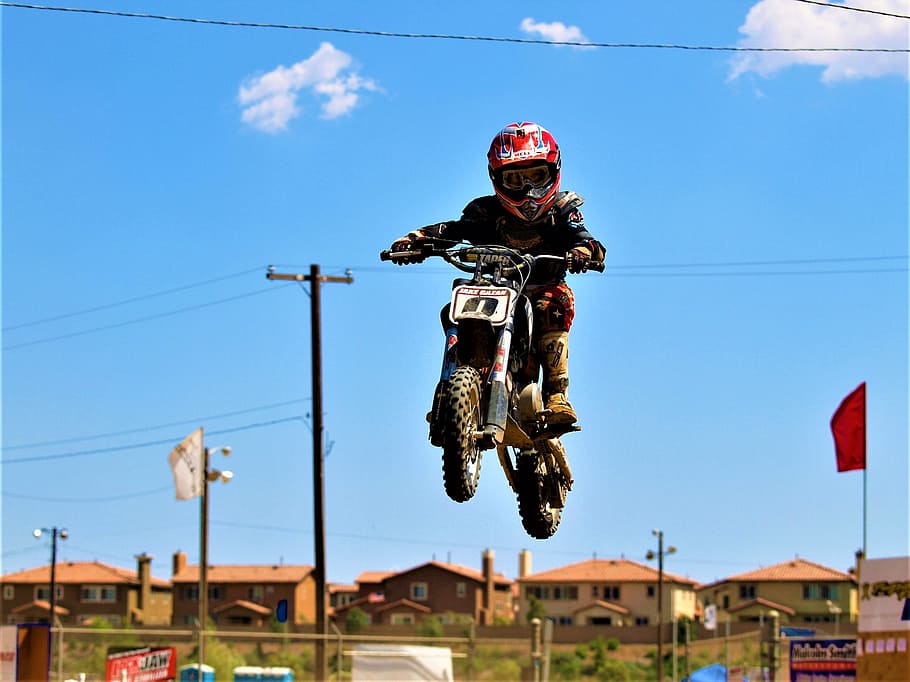 motorcycle, boy, kid, competition, catching air, blue sky, fun HD wallpaper