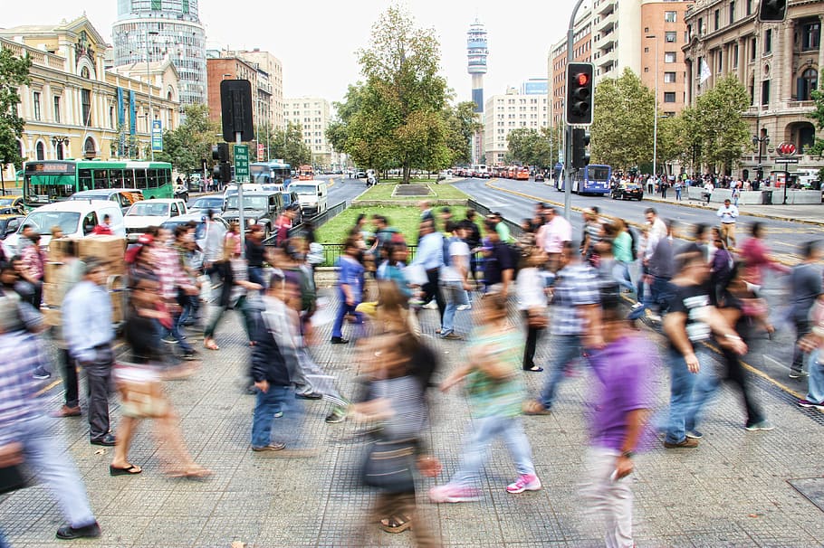 people walking on street surround with buildings during daytime HD wallpaper