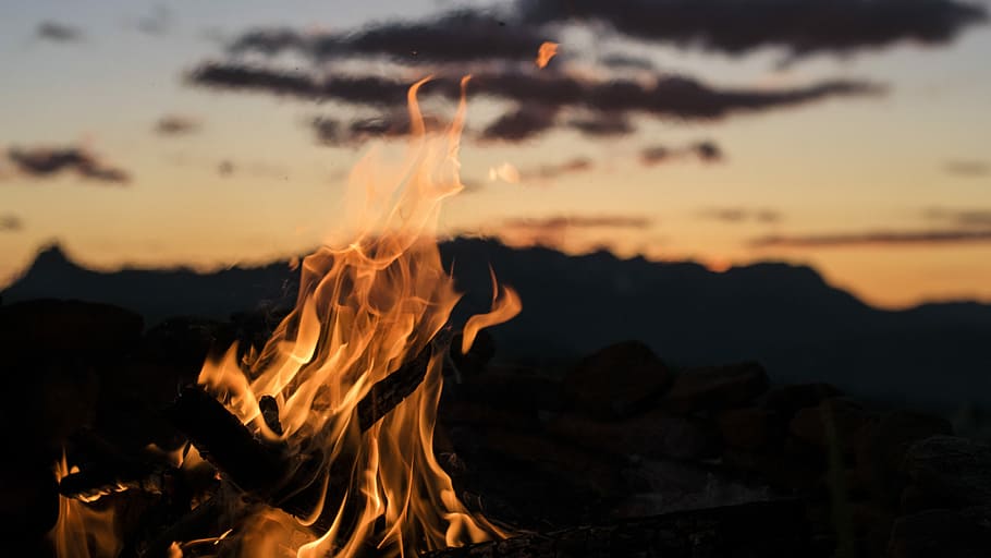 bonfire overlooking silhouette of mountain golden hour photography, close shot of bonfire HD wallpaper