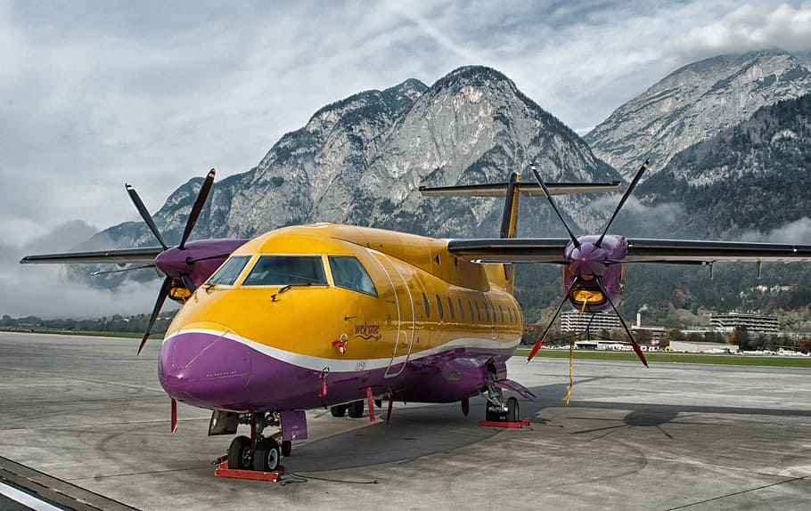 yellow and purple plane on airport, innsbruck, austria, mountains, HD wallpaper