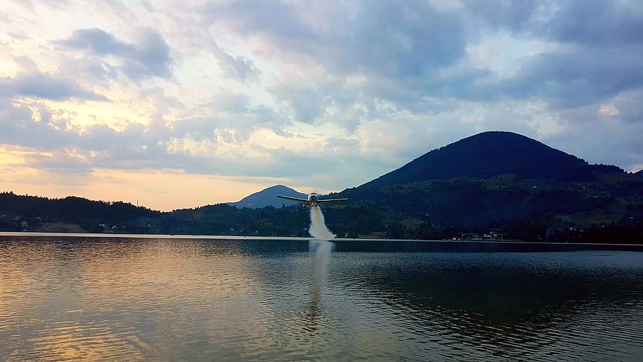 mountain, lake, plane, aviation, smoke, sky, reflection, sunset HD wallpaper
