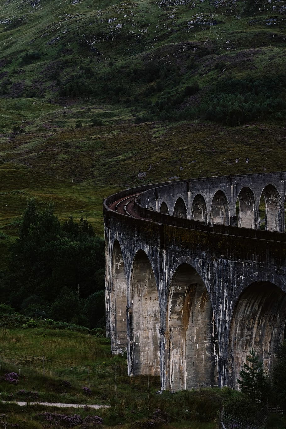 Details of the Glenfinnan Viaduct, photo of vintage brown concrete building