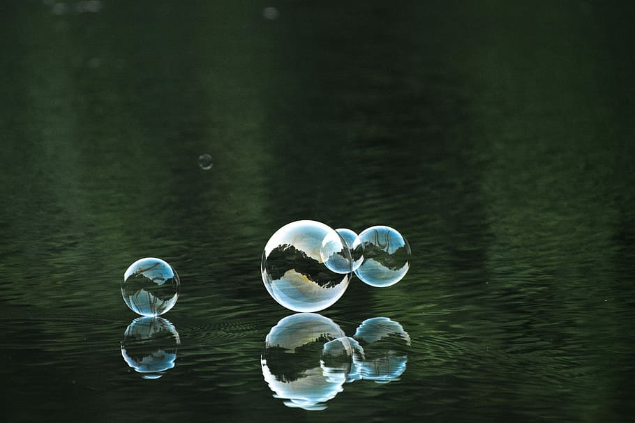 photography of bubble on body of water, four bubbles near body of water HD wallpaper