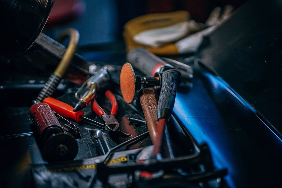 power tools on case, shallow focus photography of brown and black hand tools HD wallpaper