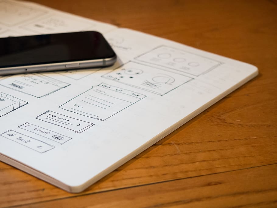 Notebook with Sketches and Phone on Desk, iphone, sketchbook HD wallpaper