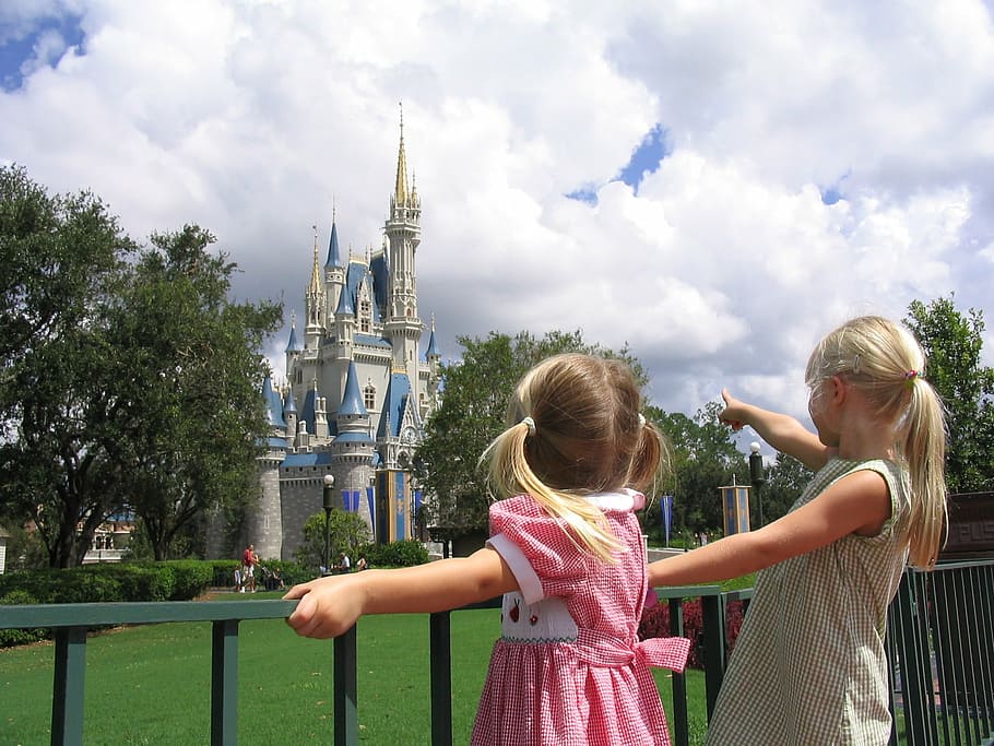 two girl's facing castle, vacation, disney, park, child, people HD wallpaper