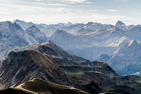 aerial photography of mountain under blue sky and white clouds view during daytime HD wallpaper