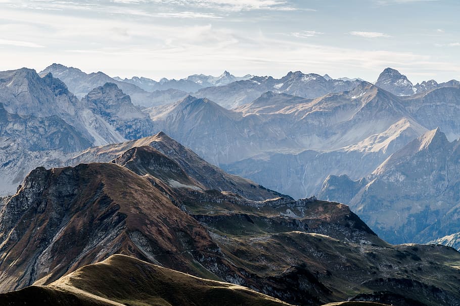 aerial photography of mountain under blue sky and white clouds view during daytime HD wallpaper