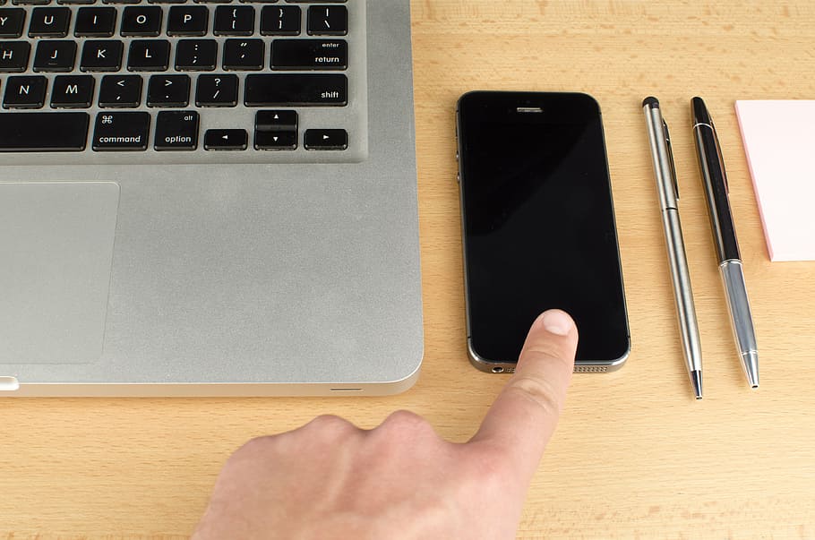 person index finger pointing black iPhone 5, laptop, apple, keyboard, HD wallpaper