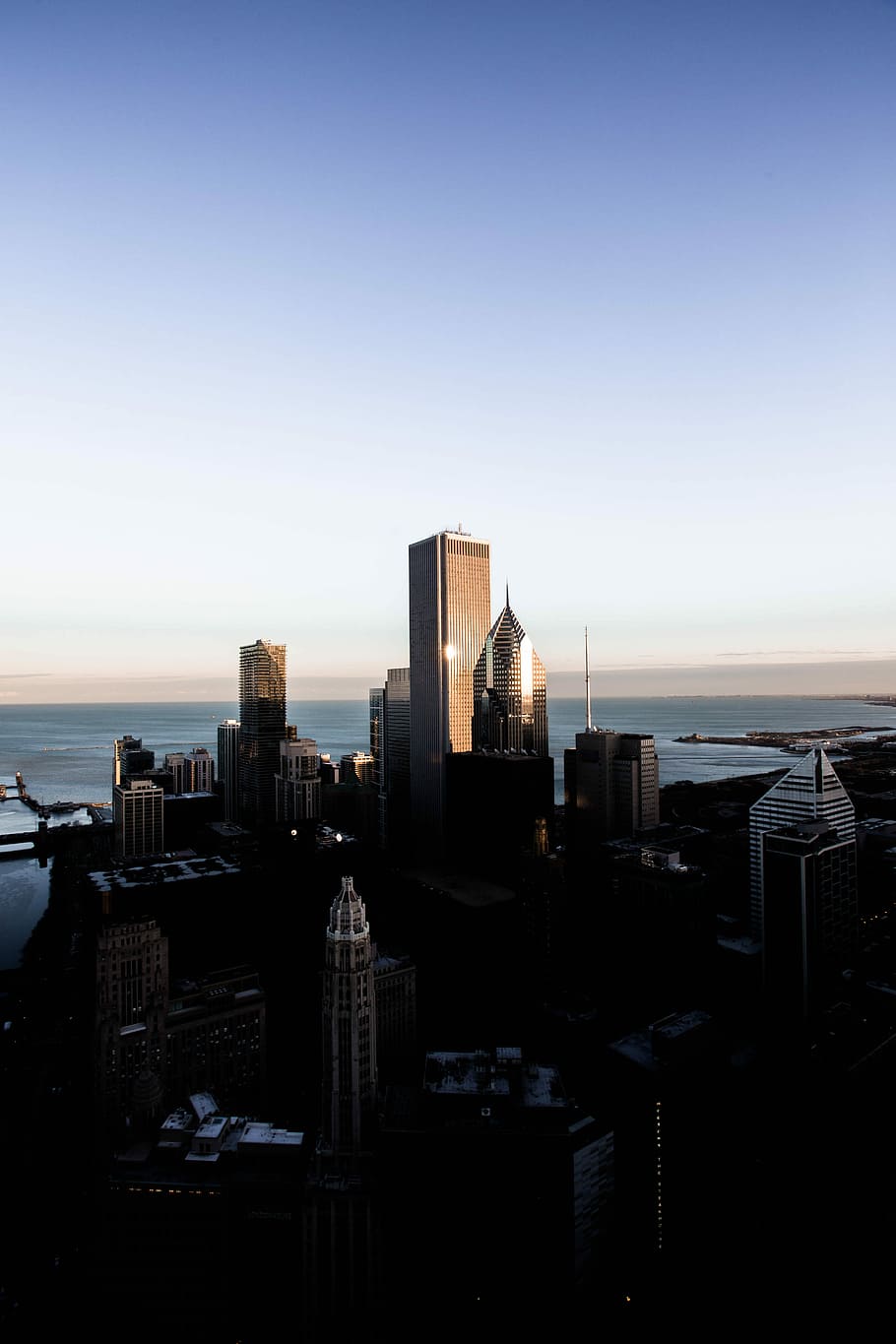 top view of city, high-rise buildings near sea at daytime, sky HD wallpaper