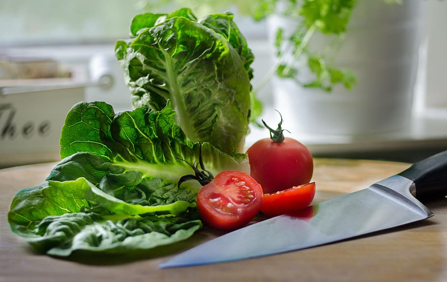 tomato and green leafy vegetable beside black handled knife HD wallpaper