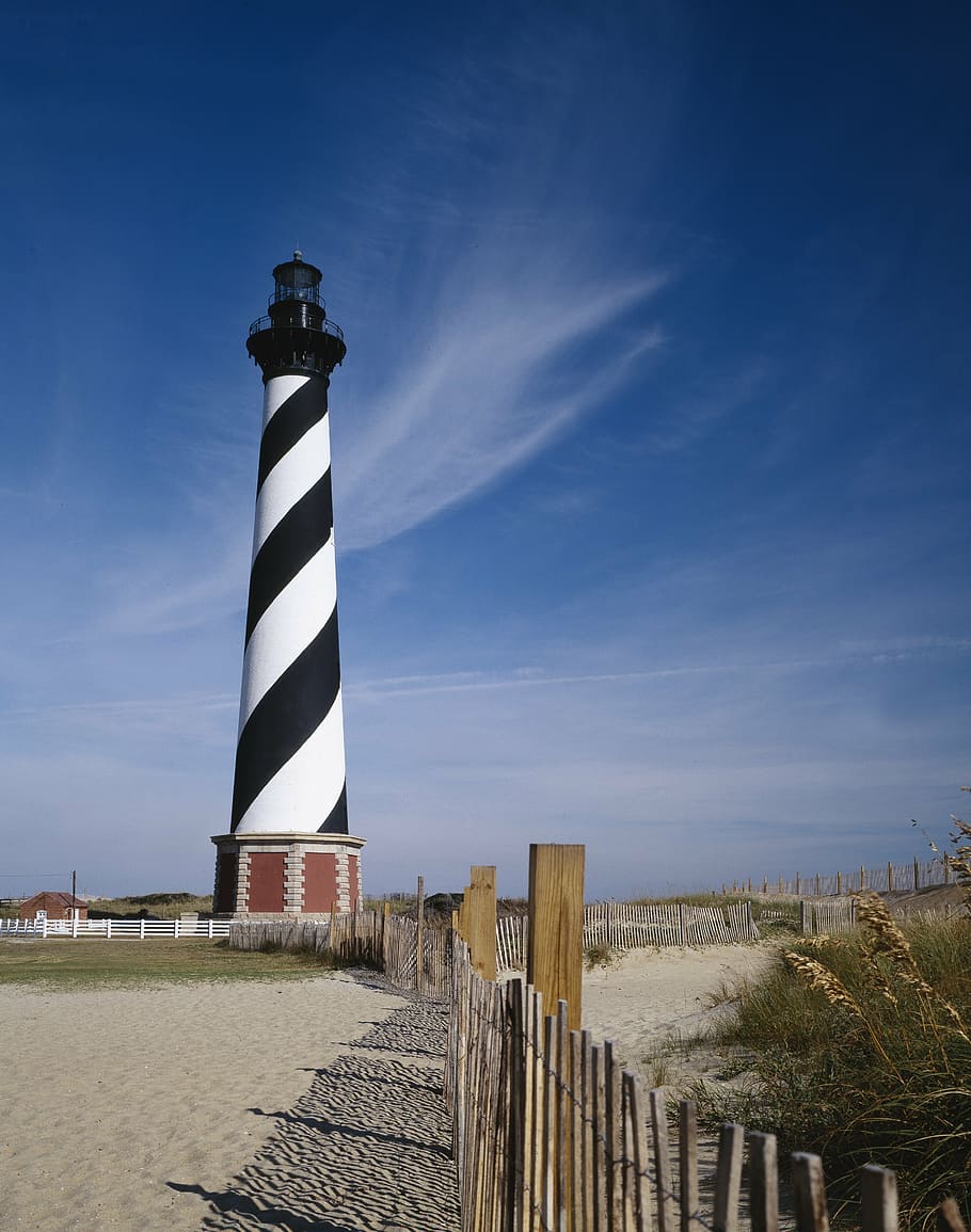 lighthouse, shore, coast, stripes, ocean, warning, coastline HD wallpaper