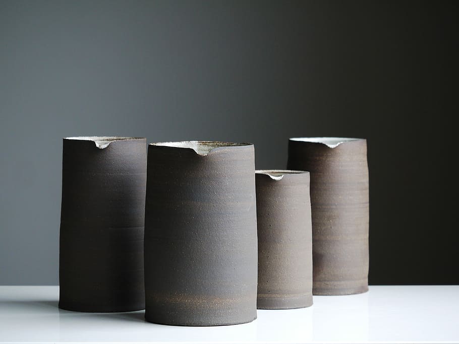 four gray jar on white surface, four brown vases, pottery, vessel HD wallpaper