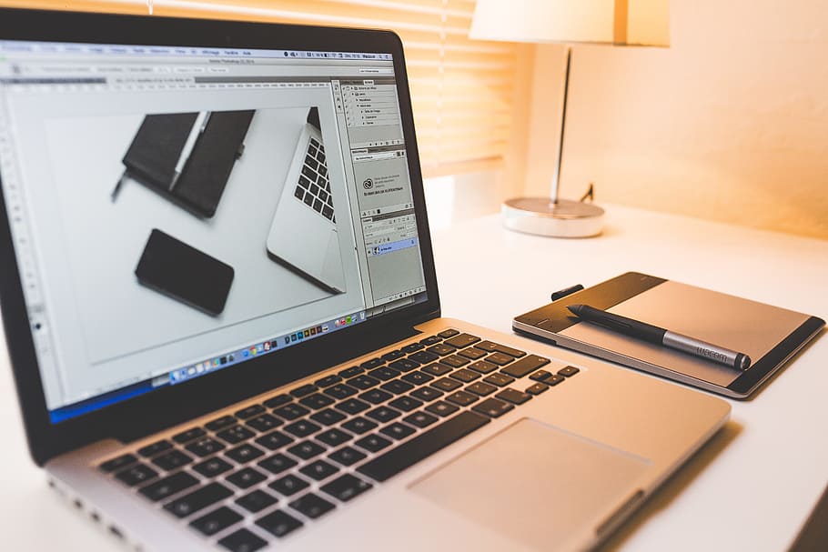turned on MacBook Pro with traction pad and pen, apple, computer HD wallpaper