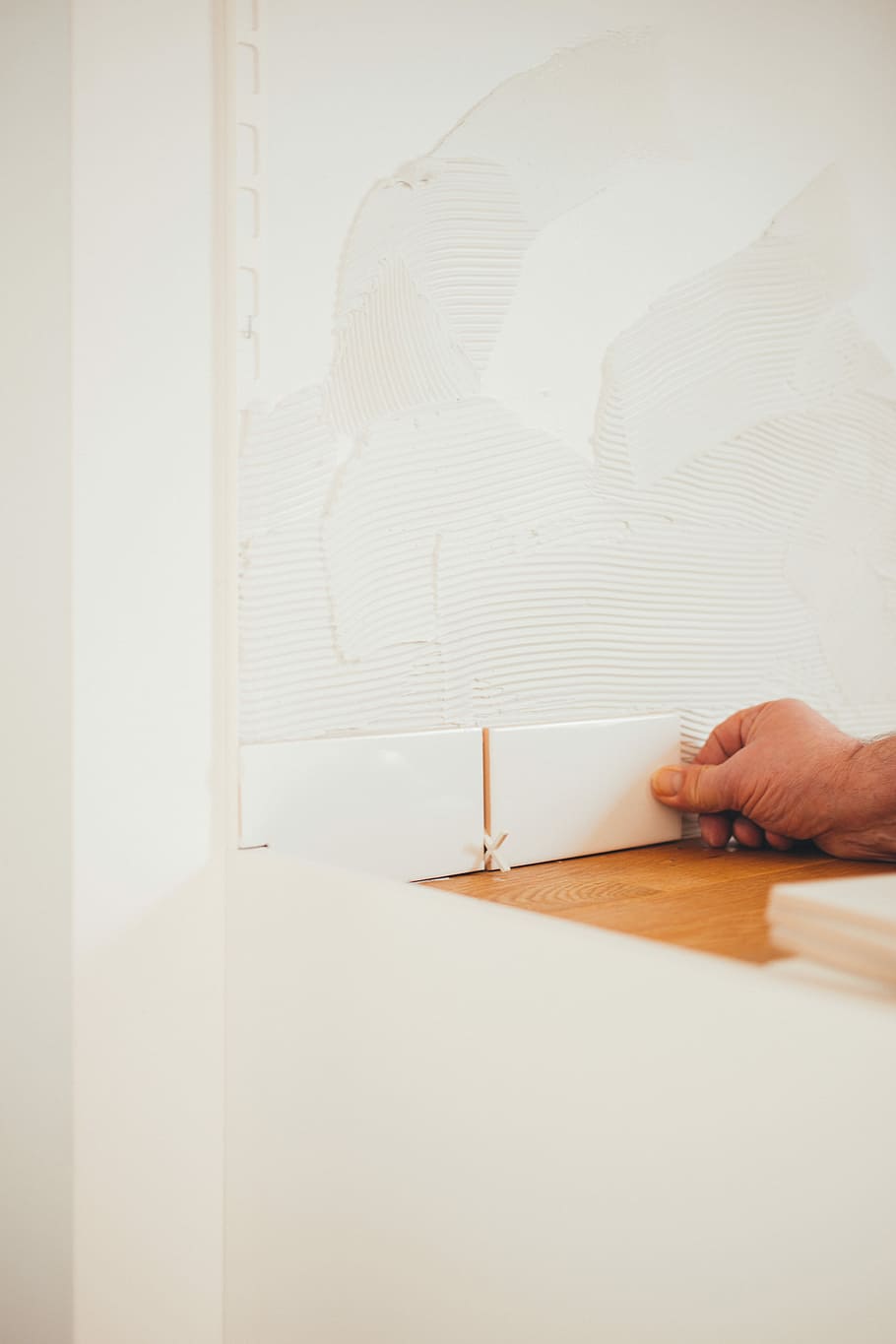 person holding white tile, person holding white ceramic tile HD wallpaper