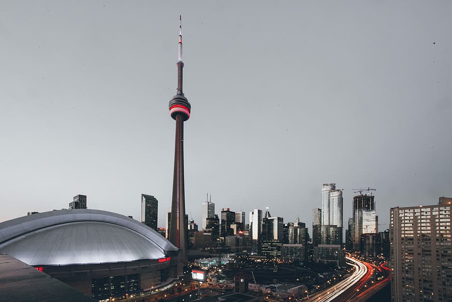 shallow focus photography of brown concrete tower, time-lapse photography of city HD wallpaper