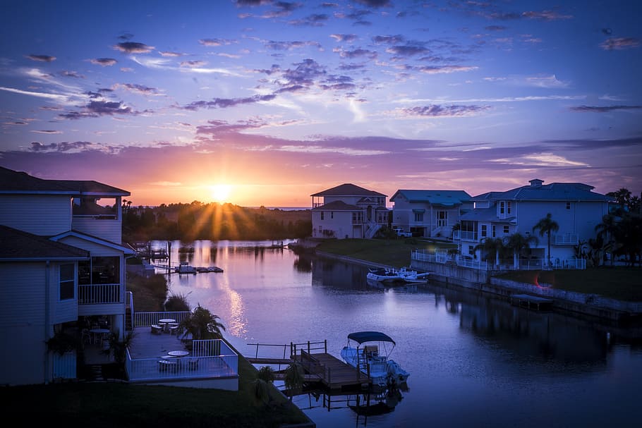 boat docked near house, sunset, canal, florida, gulf, clouds