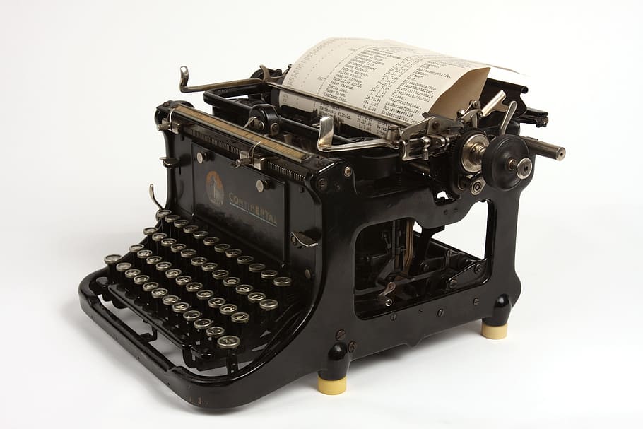 black typewriter with printer paper, old, retro, vintage, antique