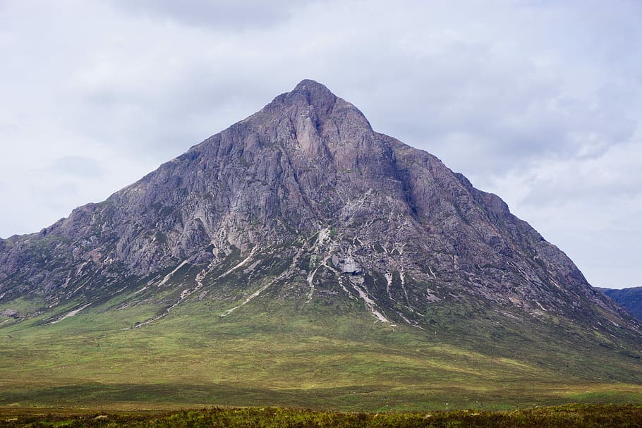 gray mountain under gray sky during daytime, black and green mountain under cloudy sky HD wallpaper