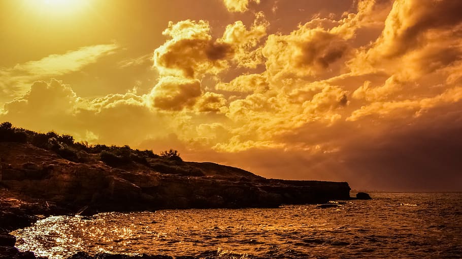 brown rock mountain during golden hour, sunset, afternoon, storm HD wallpaper