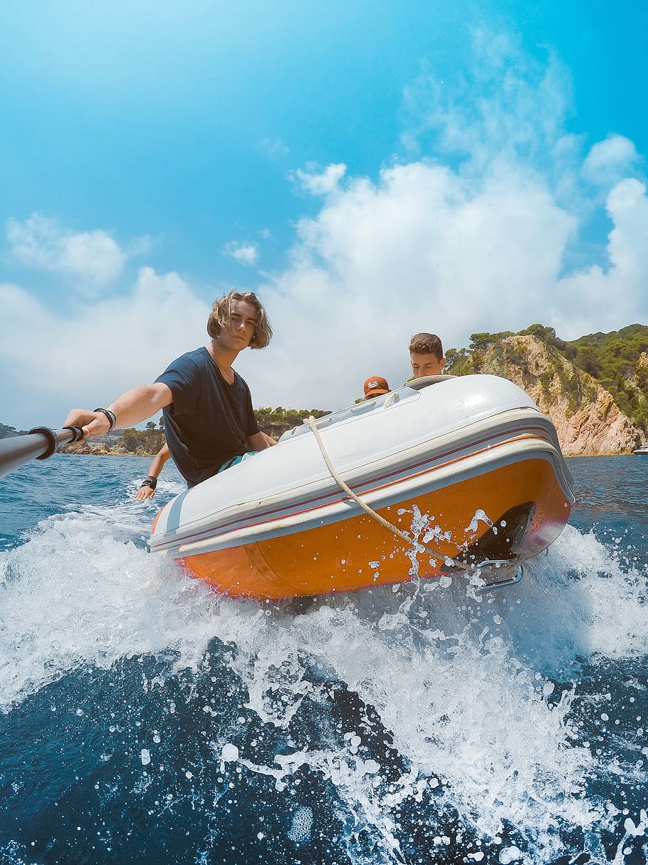 Vitamin Sea, four people riding in inflatable raft during daytime HD wallpaper