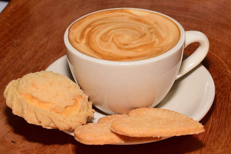 latte in ceramic teacup with three pastries on white ceramic saucer on brown wooden surface HD wallpaper