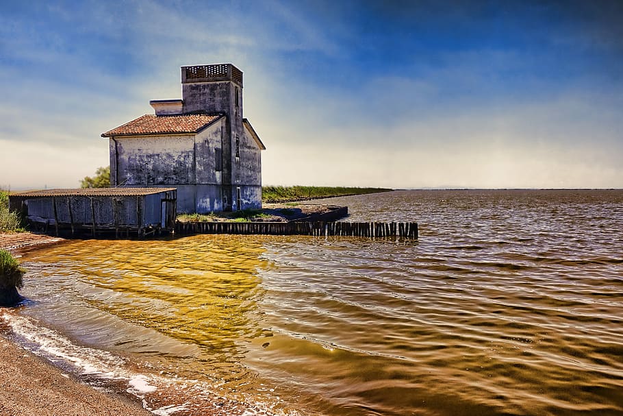 gray building near body of water and dock, waters, sky, nature HD wallpaper
