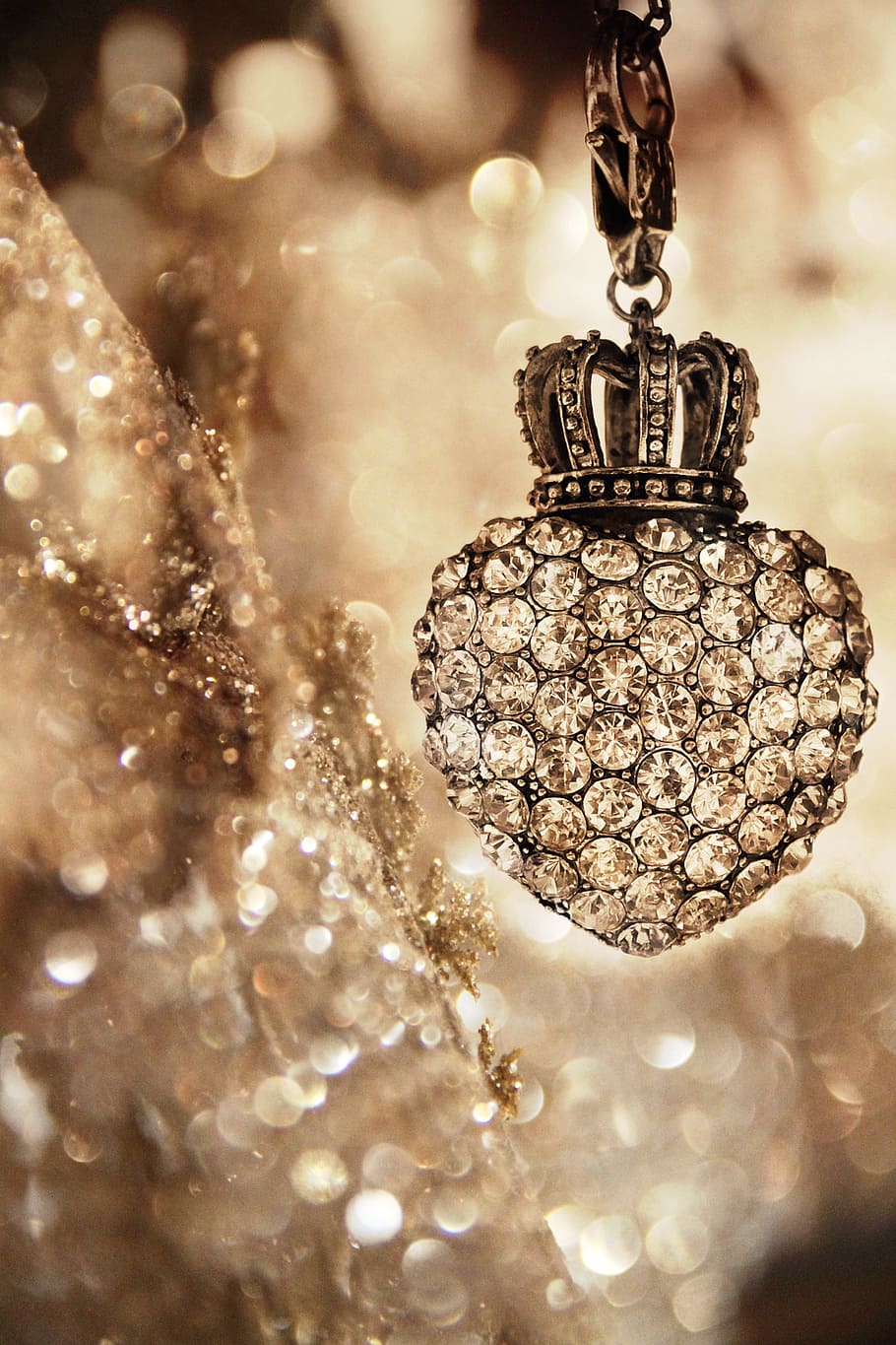 shallow focus photography of silver-colored heart pendant with clear gemstones HD wallpaper
