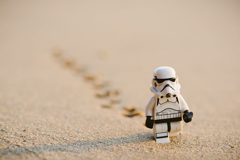 Stormtrooper minifigure walking on the sand, Star Wars Stormtrooper LEGO figurine on sand