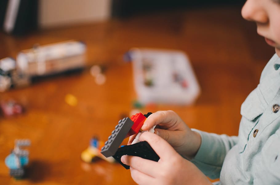 selective focus photography of toddler playing with building blocks toy, HD wallpaper