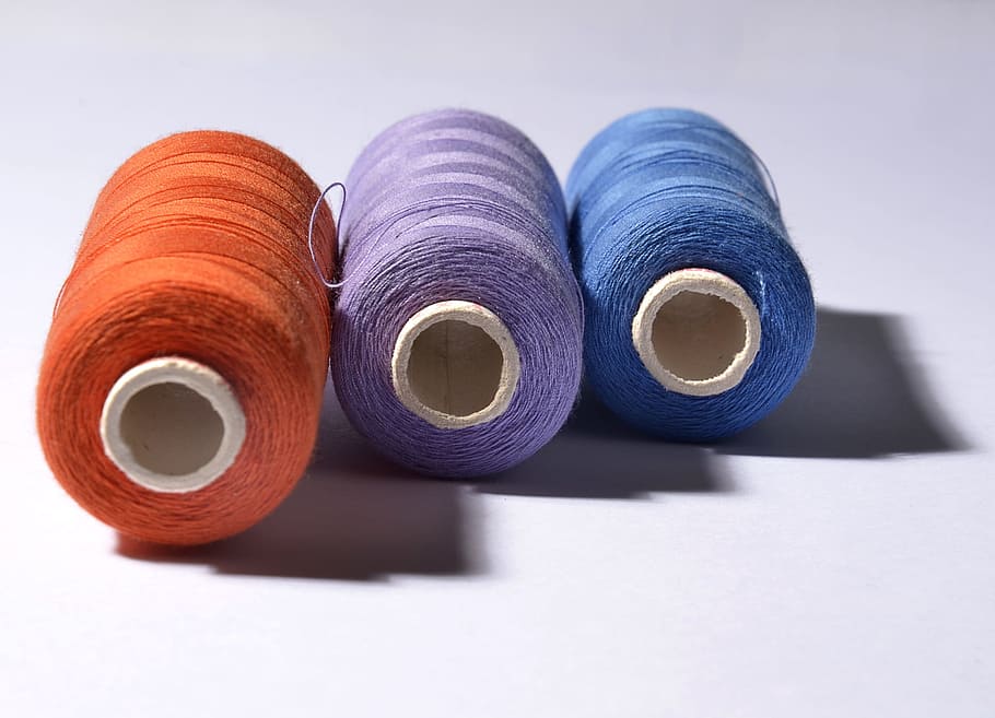 three orange, purple, and blue threads, yarn, colors, spool of thread HD wallpaper
