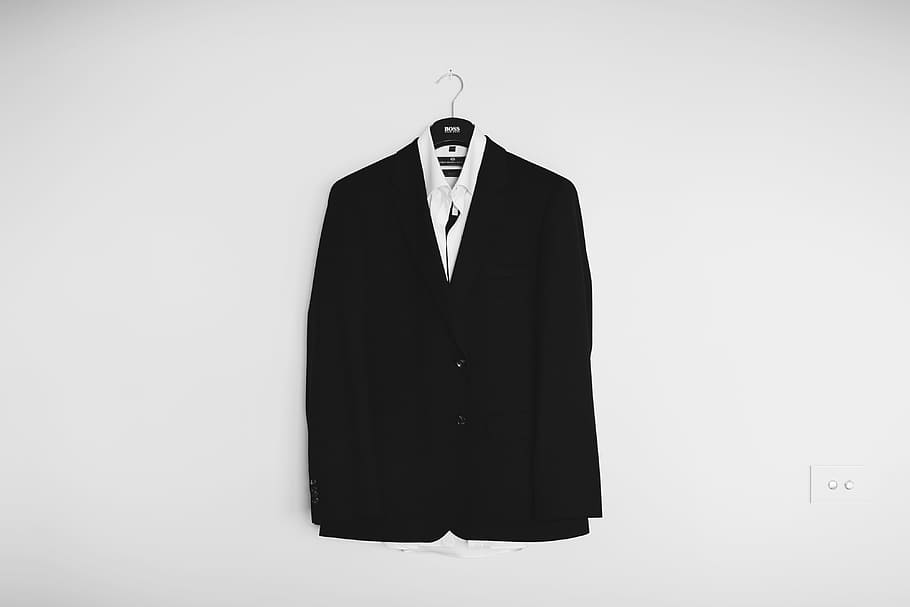 black suit jacket hanged on wall, Floating Groom Ghost, hanger