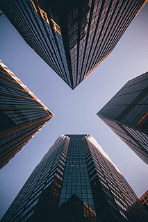 low-angle photography of four high-rise buildings, worms eye view of buildings HD wallpaper