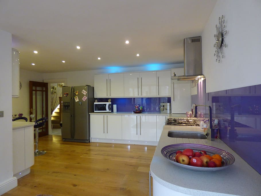white kitchen cupboards beside black side by side refrigerator with dispenser HD wallpaper
